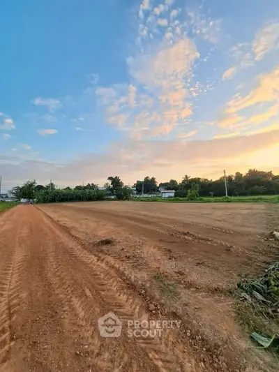 Expansive land plot with clear skies, perfect for development opportunities.