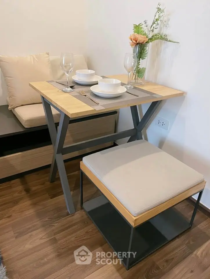 Cozy dining nook with modern table and seating, perfect for intimate meals.