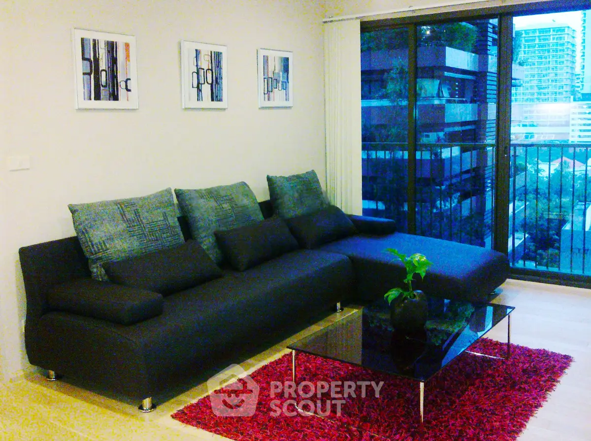 Modern living room with stylish sofa and city view balcony