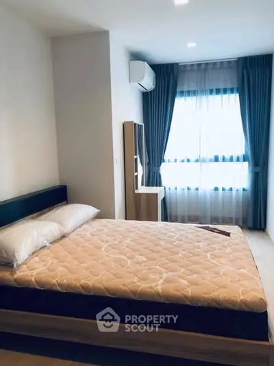 Cozy bedroom with natural light and modern furnishings