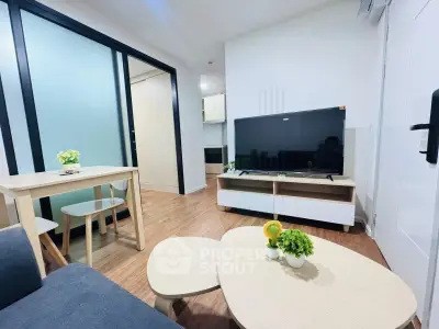 Modern living room with sleek furniture and large TV in stylish apartment