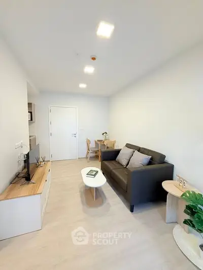 Modern living room with sleek furniture and bright lighting