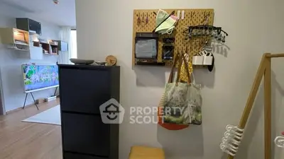 Modern living room with stylish storage and wall-mounted organizer