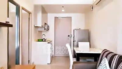 Modern apartment interior with compact kitchen and cozy dining area