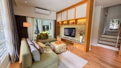 Stylish living room with modern decor and large windows for natural light