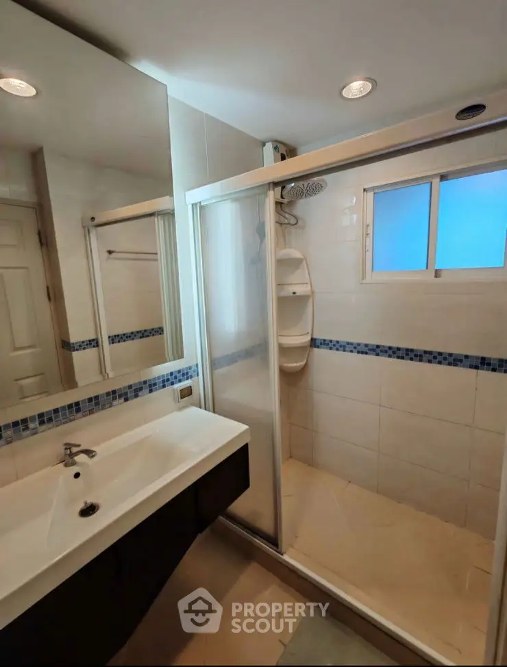 Modern bathroom with glass shower and sleek sink design