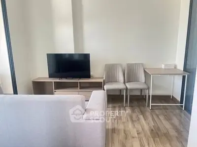 Modern living room with sleek furniture and wooden flooring