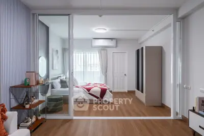 Modern bedroom with glass partition and stylish decor