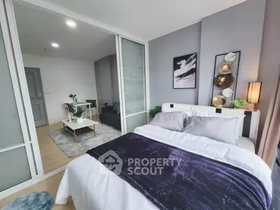Modern bedroom with stylish decor and open layout in a contemporary apartment.