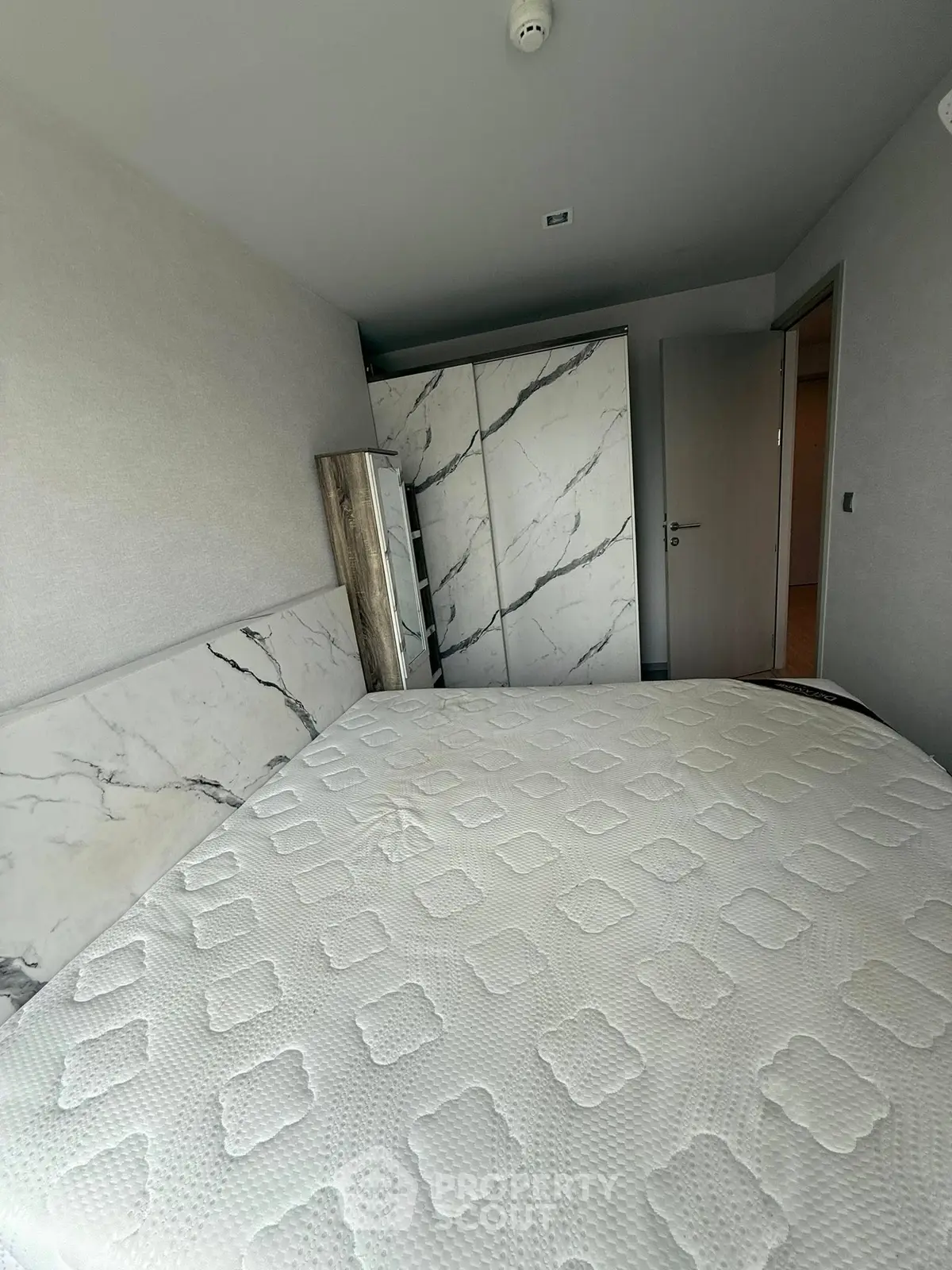 Modern bedroom with marble accents and stylish decor