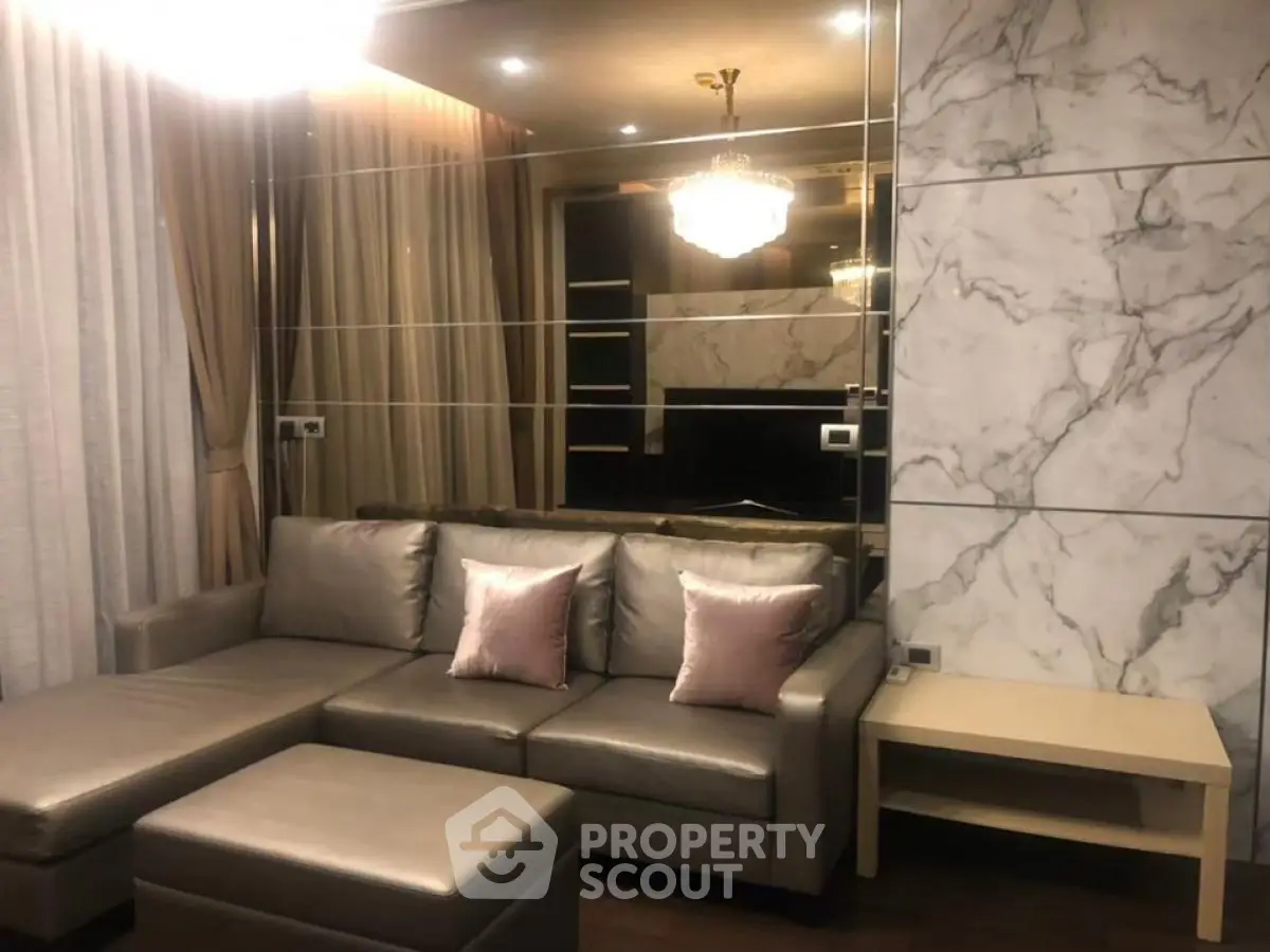 Luxurious living room with elegant marble wall and plush leather sofa