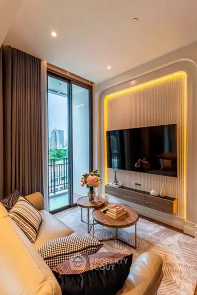 Luxurious living room with modern decor and balcony view in urban apartment