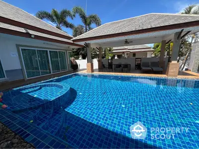 Luxurious villa with stunning pool and spacious outdoor area in tropical setting.