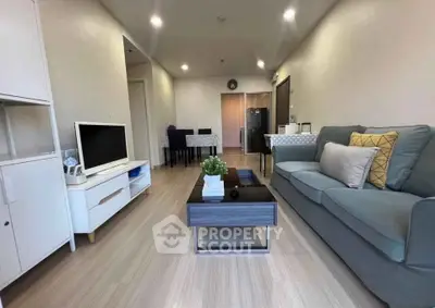 Modern living room with stylish furniture and open layout, perfect for cozy gatherings.