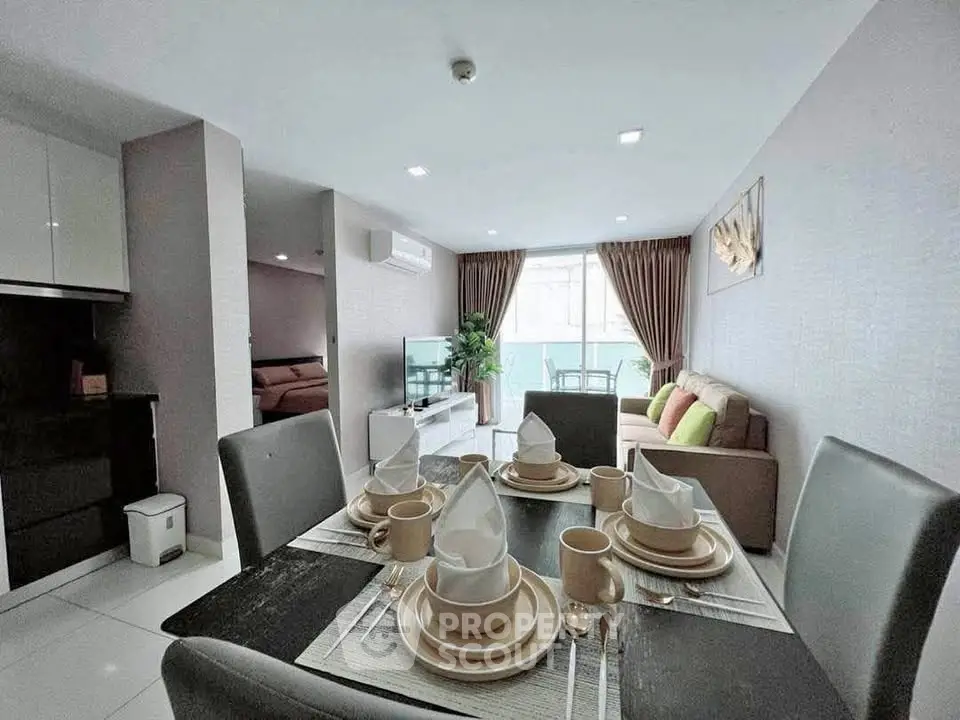 Spacious modern living room with elegant dining area and natural light