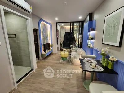Modern living room with stylish decor and open layout, featuring cozy seating and elegant dining area.