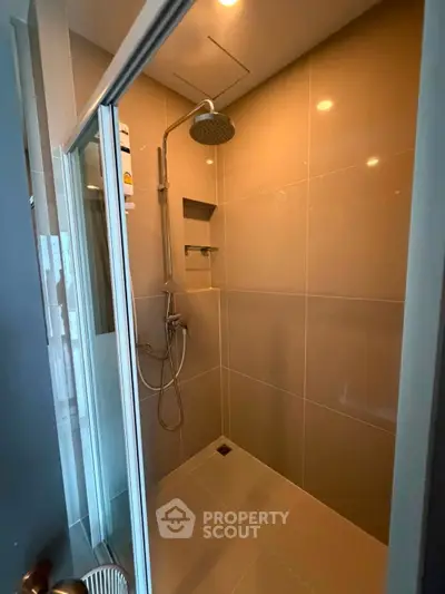 Modern bathroom with sleek shower design and glass door enclosure