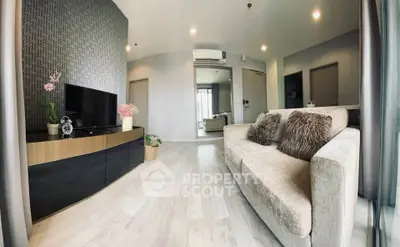 Modern living room with stylish decor and cozy seating in a contemporary apartment.