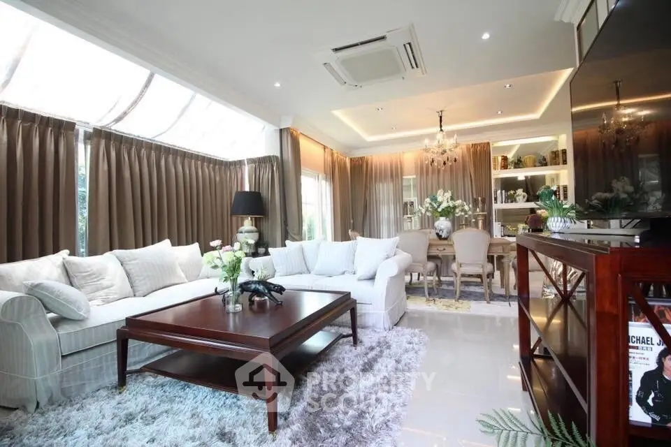 Luxurious living room with elegant decor and ample natural light