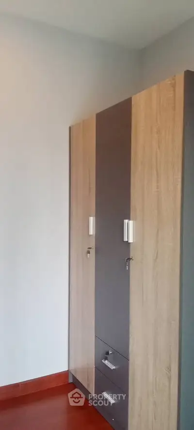Modern wooden wardrobe in a stylish room with hardwood flooring