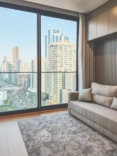 Modern living room with large window offering stunning city view