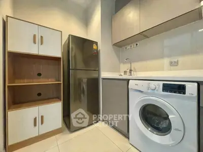 Modern kitchen with sleek appliances and ample storage space