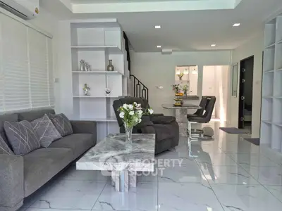 Modern living room with elegant marble flooring and stylish furniture in a contemporary home.