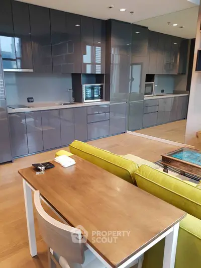 Modern kitchen with sleek cabinets and open layout in stylish apartment