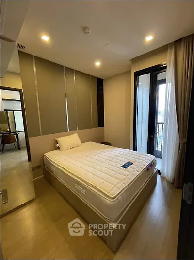 Modern bedroom with large window and minimalist decor