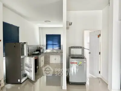 Modern kitchen with sleek appliances and open layout design