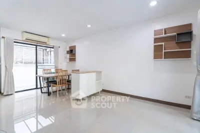 Spacious modern living room with dining area and stylish shelving