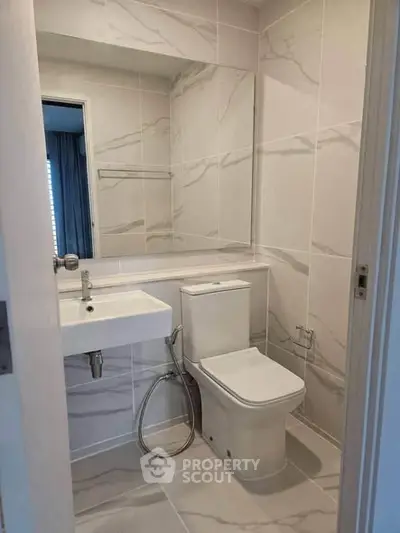 Modern bathroom with sleek fixtures and elegant tile design
