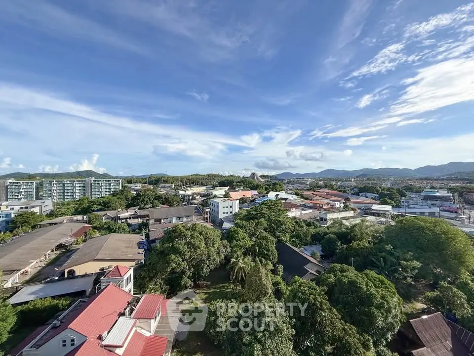 Stunning aerial view of a vibrant urban landscape with lush greenery and distant mountains.