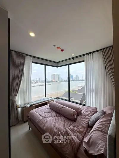 Luxurious bedroom with panoramic river view and elegant decor