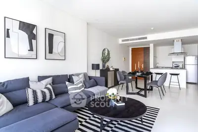 Modern living room with stylish decor and open kitchen layout
