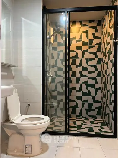 Modern bathroom with geometric tile shower and sleek fixtures
