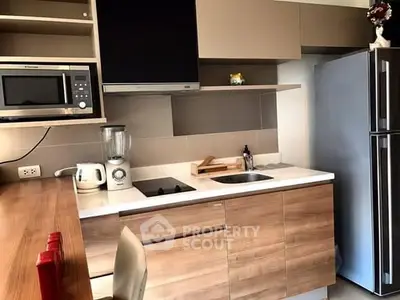 Modern kitchen with sleek cabinetry and stainless steel appliances