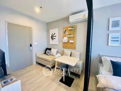 Modern living room with cozy seating and stylish decor in a contemporary apartment.