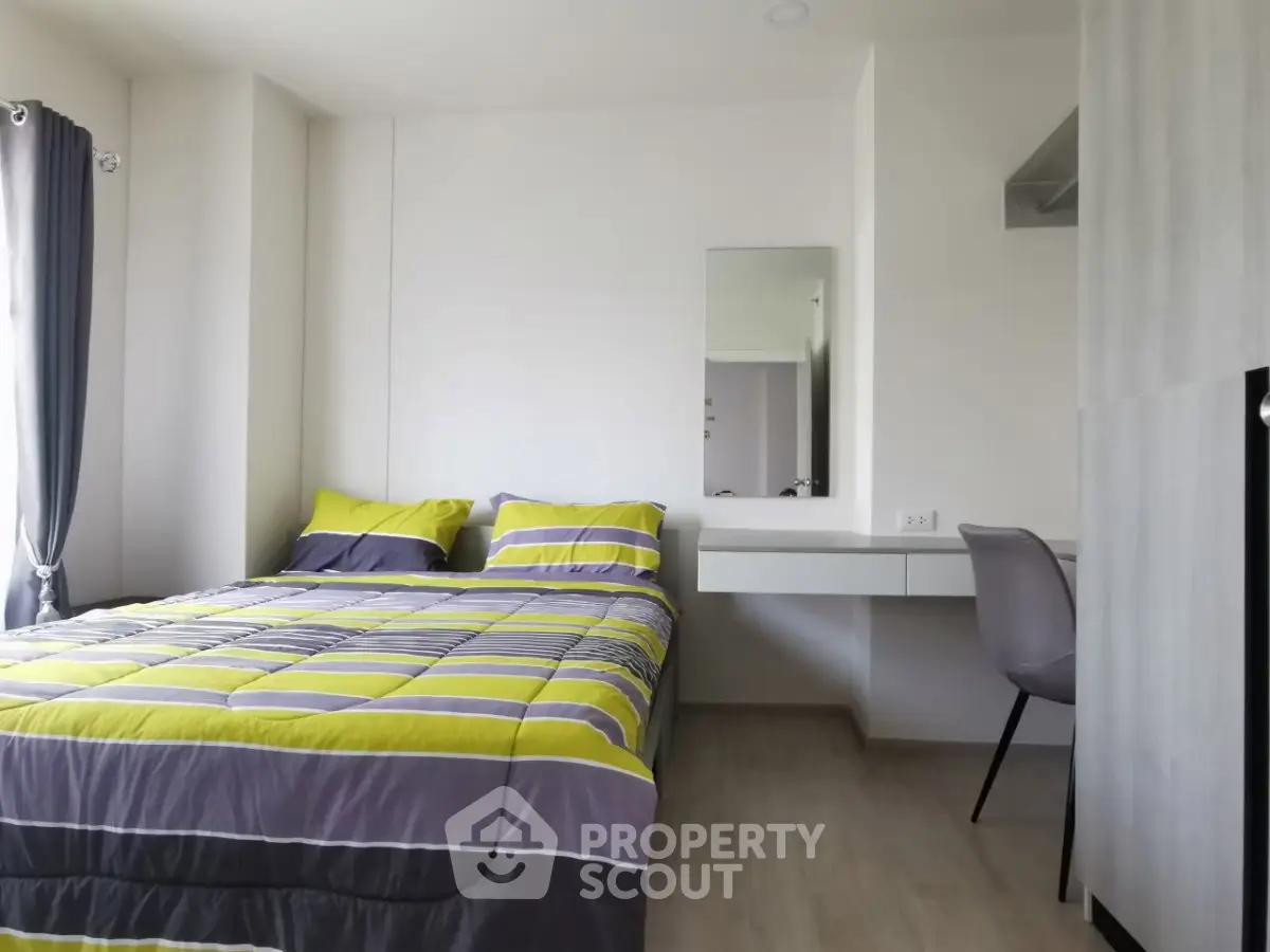 Modern bedroom with stylish decor and cozy ambiance, featuring a comfortable bed and sleek furnishings.