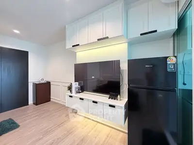 Modern living room with sleek TV setup and stylish storage cabinets