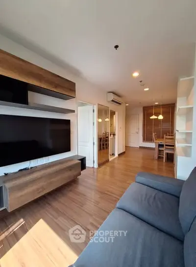 Modern living room with wooden flooring and stylish furniture