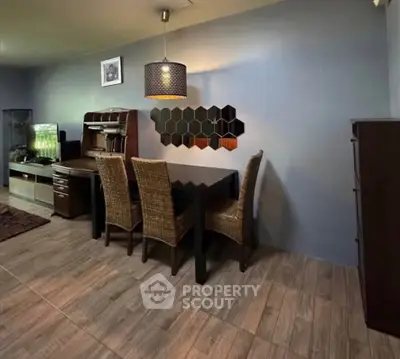 Stylish dining area with modern decor and wooden furniture in a cozy home setting.