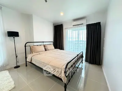 Modern bedroom with sleek metal bed frame and large window view
