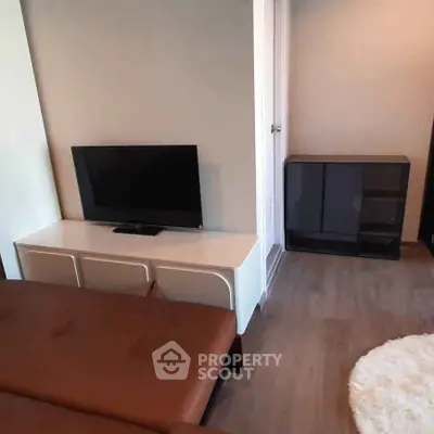 Modern living room with sleek TV stand and cozy seating area