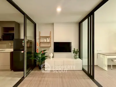 Modern open-plan living room with sleek kitchen and stylish decor