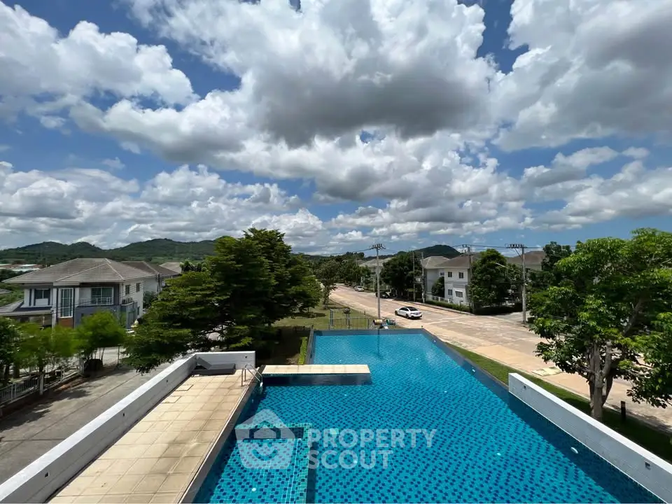 Stunning pool view with scenic backdrop in a serene neighborhood