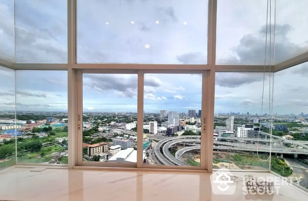 Stunning panoramic city view from high-rise apartment window