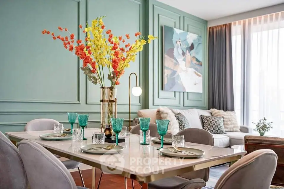 Elegant dining area with stylish decor and cozy living room, perfect for modern living.