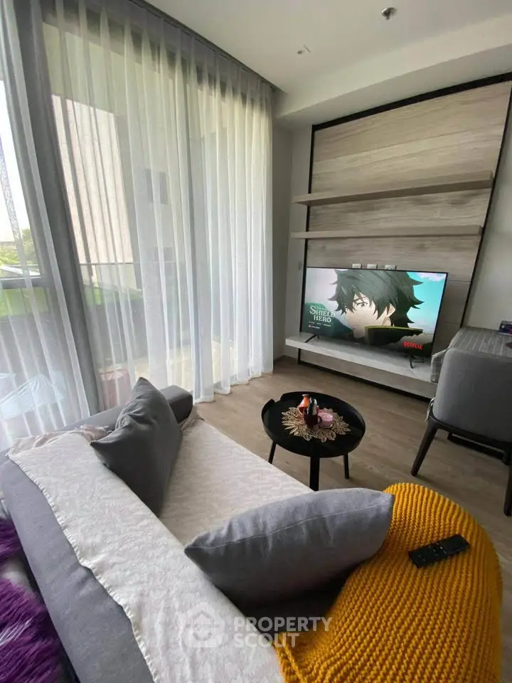 Modern living room with stylish decor and large windows for natural light
