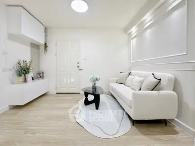 Modern living room with white sofa and elegant decor